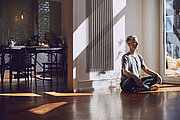 man meditates, old building flat, relaxed, charleston